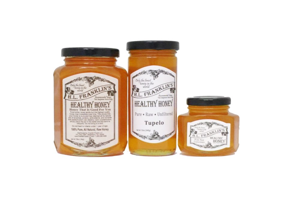 Three jars of mustard with vintage-style labels.