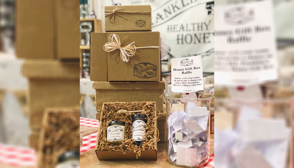 Stacked boxes and bottles of San Pellegrino sparkling water at a store display.